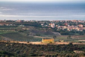 Agrigento, Sicily, Italy cityscape towards the Valley of the Temples and the Mediterranean at dawn.