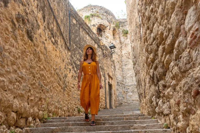 girona-medieval-city-a-young-tourist-walking-thro-2024-12-09-04-59-16-utc