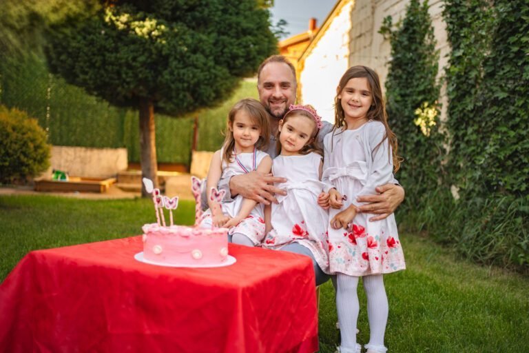 Joyful birthday celebration with family in a sunny garden