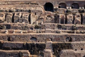 Long shot of interior of the Colosseum with arena details in Rome, Italy